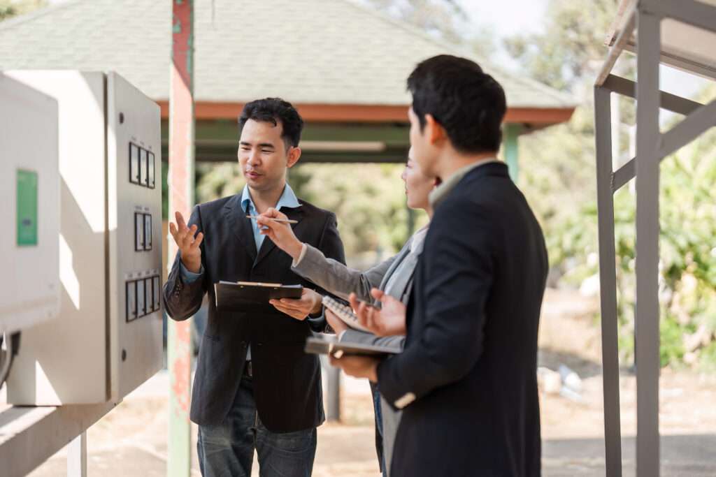 A team of diverse professionals actively discussing sustainable energy management solutions, promoting collaboration and innovative thinking.